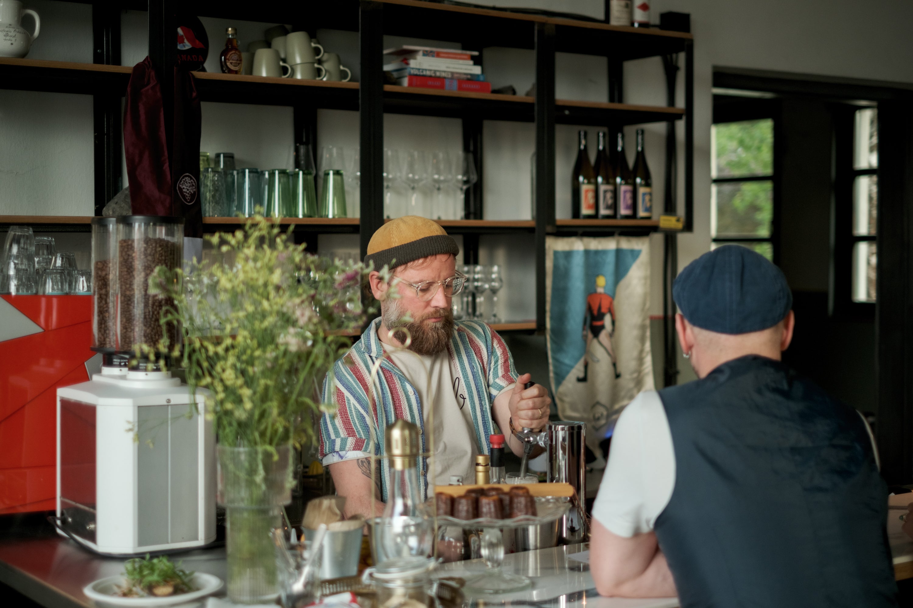 b-üzem organic wine bar with a barista serving customers.